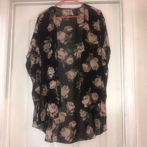 This is a black kimono with rose detailing.